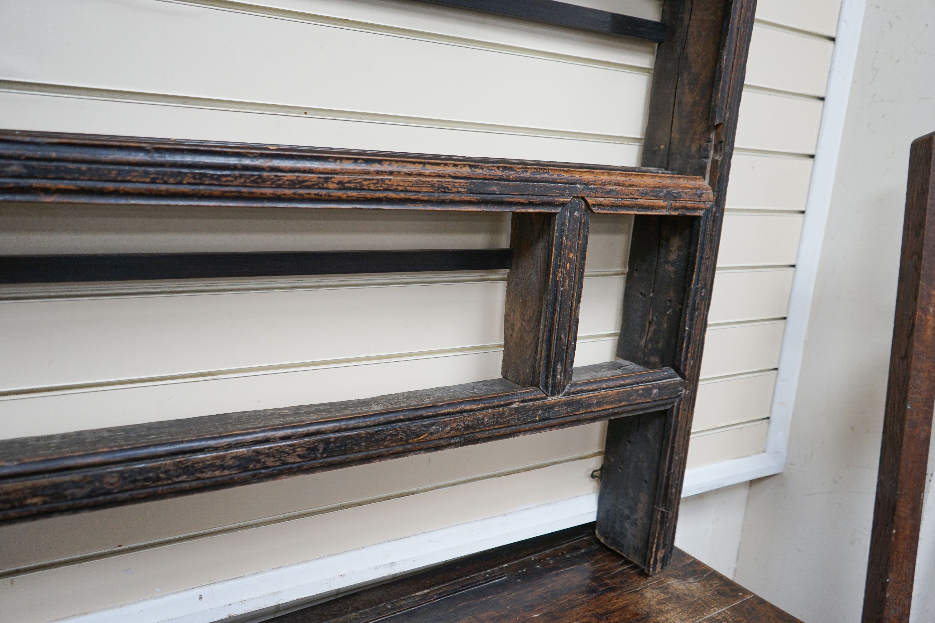 An 18th century and later oak dresser, the base fitted two drawers on turned supports, with two-tier plate rack over, width 147cm, depth 50cm, height 181cm